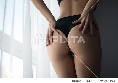 Crop woman with perfect buttocks Crop woman with perfect buttocks 76968493