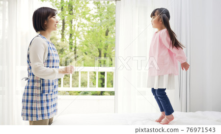 Jumping girl childcare / childcare image Jumping girl childcare / childcare image 76971543