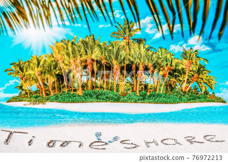 Whole tropical island within atoll in tropical Ocean and inscription "Maldives" in the sand on a tropical island,  Maldives. 76972213