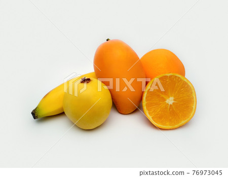 fresh mix of fruits mango, guava, orange, banana.yellow tropical fruits 76973045