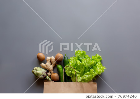 Healthy and organic food flay lay concept on gray background 76974240