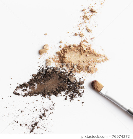 Scattered light and dark brown face shadow and eye shadow or make-up brush 76974272