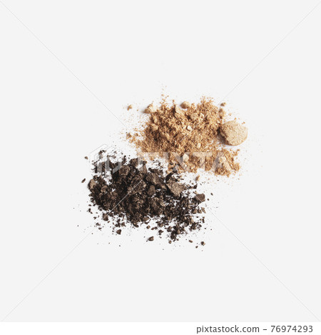 Isolated light and dark brown face or eye shadow on white background 76974293