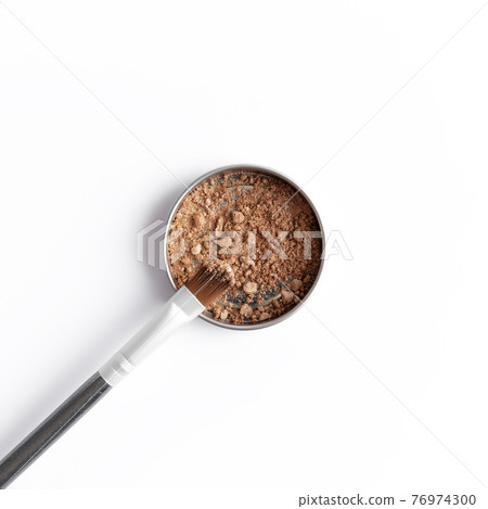 Light brown face shadow in container and eye shadow or make-up brush 76974300