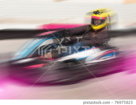 Female driving car for karting Female driving car for karting 76975823