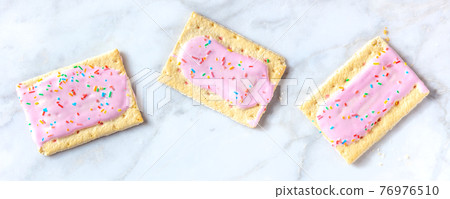 Strawberry pop tart panoramic banner on a white marble background Strawberry pop tart panoramic banner on a white marble background 76976510