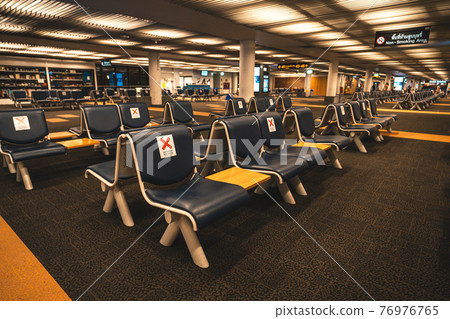 Seats and signs in the airport Seats and signs in the airport 76976765