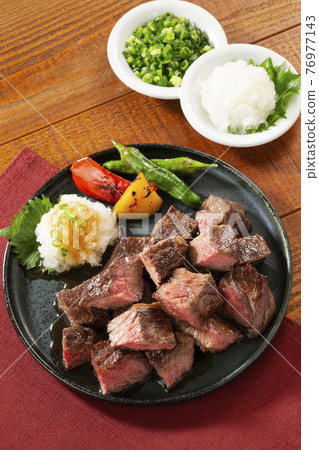 Japanese-style grated dice steak on a plate Japanese-style grated dice steak on a plate 76977143