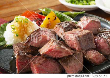 Japanese-style grated dice steak on a plate 76977145