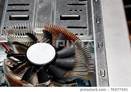 Video card fan close up on background of computer Video card fan close up on background of computer 76977491