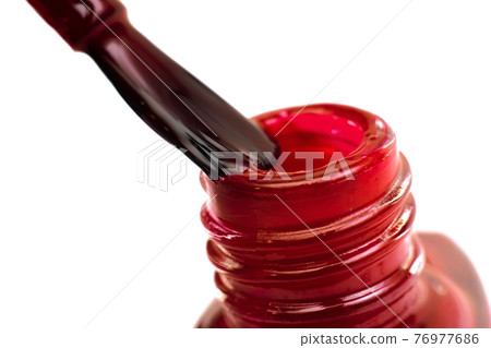 Brush and jar with red nail polish, isolated 76977686
