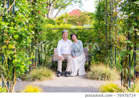 Senior couple living tiles enjoying Yokohama surrounded by fresh greenery 76978714