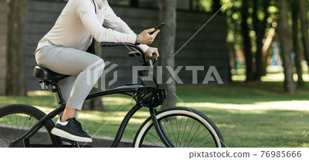 Young stylish businessman going to work by bike, eco transport in city 76985666
