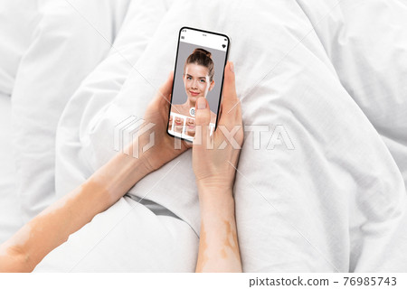 Augmented Reality Beauty App. Woman Trying Different Lipstick Color Online 76985743
