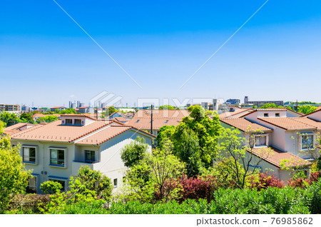 Tama New Town, a suburban residential area with a wide blue sky 76985862
