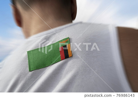 The national flag of Zambia on the athlete's back The national flag of Zambia on the athlete's back 76986143