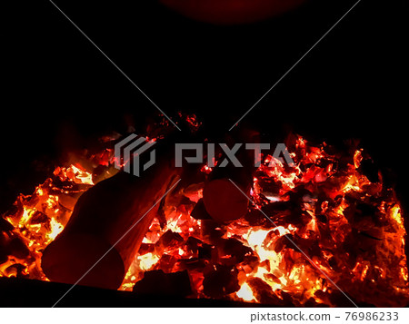 Fire place. Firebox with woodedn sticks. Fire place. Firebox with woodedn sticks. 76986233