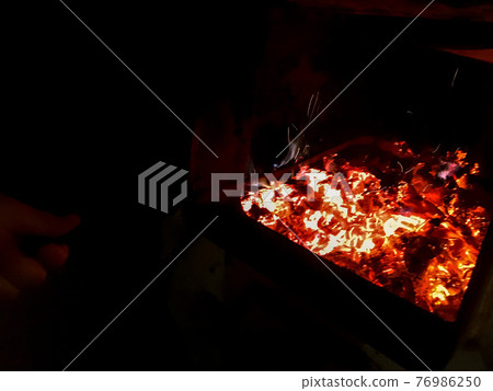 Fire place. Firebox with woodedn sticks. 76986250