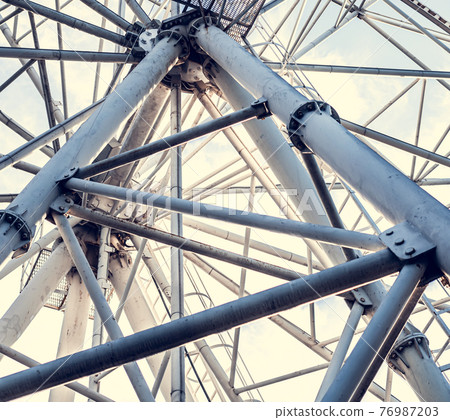 Gray or white metal ferris wheel with closed Gray or white metal ferris wheel with closed 76987203