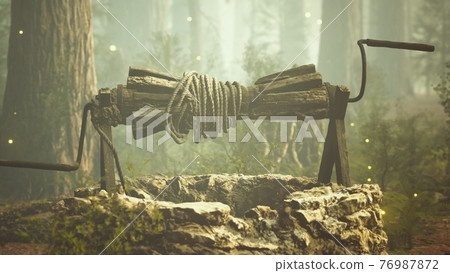old stone draw well in the forest with fog 76987872
