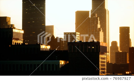 skyscrapers of big city at sunset 76987927
