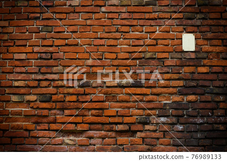 Brick wall red old weathered texture background. Grunge old house aged dark bricks. 76989133