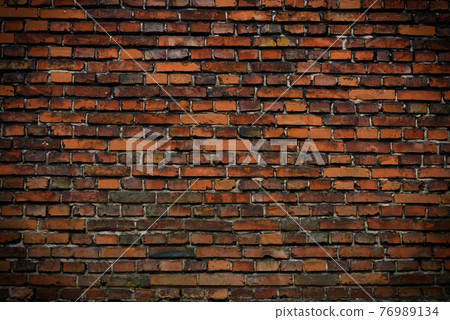 Brick wall red old weathered texture background. Grunge old house aged dark bricks. 76989134