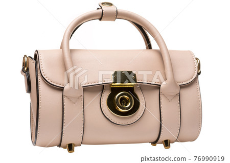 beige female bag on white background, picture with details, close-up beige female bag on white background, picture with details, close-up 76990919