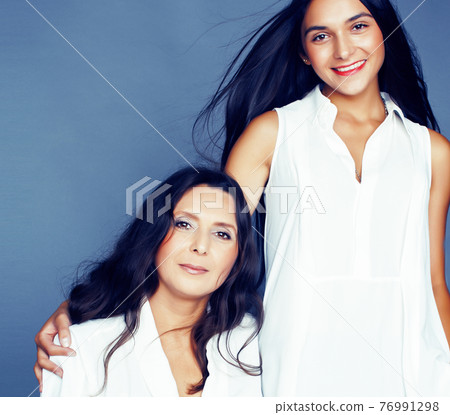 cute pretty teen daughter with mature mother hugging, fashion style brunette, lifestyle people concept cute pretty teen daughter with mature mother hugging, fashion style brunette, lifestyle people concept 76991298