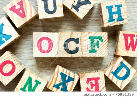 Alphabet letter block in word OCF (Abbreviation of Operating cash flow) with another on wood background Alphabet letter block in word OCF (Abbreviation of Operating cash flow) with another on wood background 76991359