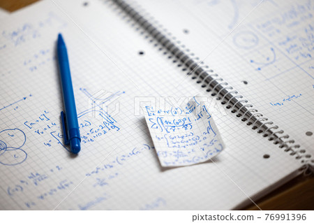 Math handwriting in notebook closeup Math handwriting in notebook closeup 76991396