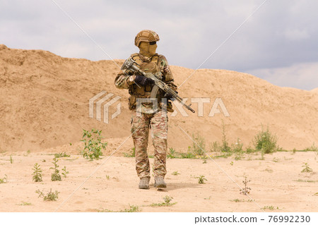 Equipped and armed special forces soldier Equipped and armed special forces soldier 76992230