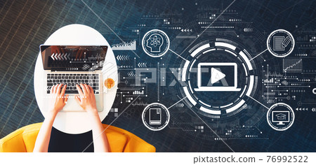Webinar concept with person using a laptop Webinar concept with person using a laptop 76992522