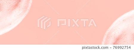 The texture of a scrub or shower gel on a pink background. The texture of a scrub or shower gel on a pink background. 76992754