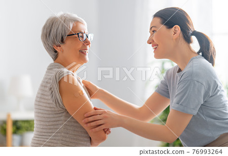 Senior woman after vaccination. 76993264