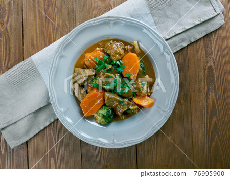 German traditional beef stew with carrots, dark beer 76995900