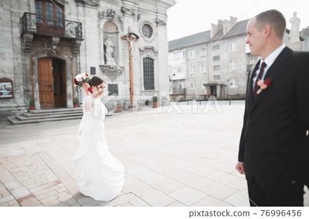 Luxury married wedding couple, bride and groom posing in old city 76996456