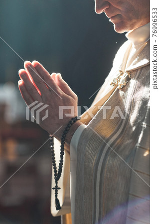 Priest at the ceremony 76996533