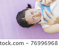 Sleeping in the living room Smartphone woman Fitness beauty 76996968