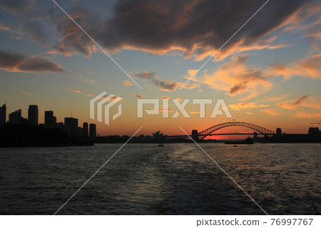 Skyline of Sydney at sunset. Skyline of Sydney at sunset. 76997767
