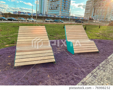 Sun white beds in the park. relax zone in the city. Improvement of public services, outdoor Sun white beds in the park. relax zone in the city. Improvement of public services, outdoor 76998232
