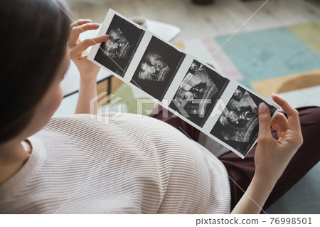 A person holding a book A person holding a book 76998501
