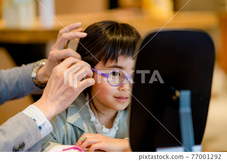 Girl wearing glasses debuts with glasses Girl wearing glasses debuts with glasses 77001292