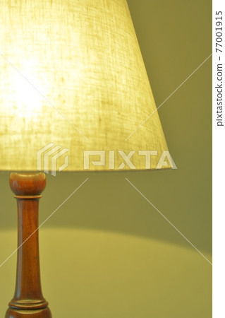 Mahogany antique lamp in a dimly lit room. British furniture (vivid tone, soft focus) Mahogany antique lamp in a dimly lit room. British furniture (vivid tone, soft focus) 77001915