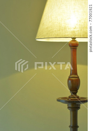 Mahogany antique lamp in a dimly lit room. British furniture (vivid tone, soft focus) 77001921