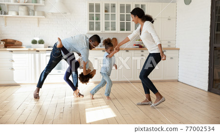 Excited African American family celebrating moving into new house 77002534