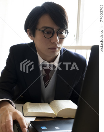 Male student studying at home 77003765