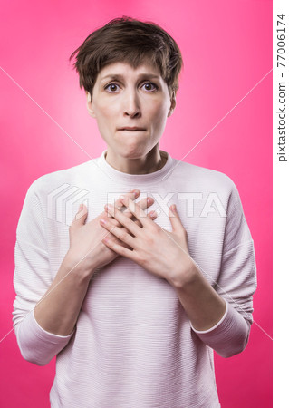 Why is that. Beautiful female half-length portrait isolated on trendy pink studio backgroud. Why is that. Beautiful female half-length portrait isolated on trendy pink studio backgroud. 77006174