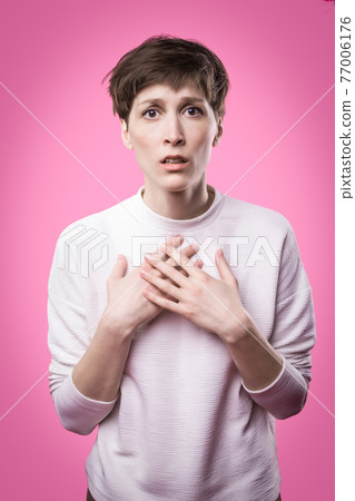 Why is that. Beautiful female half-length portrait isolated on trendy pink studio backgroud. Why is that. Beautiful female half-length portrait isolated on trendy pink studio backgroud. 77006176