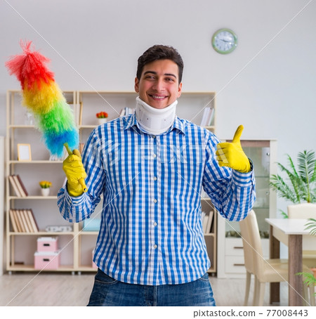 Man with neck unjury cleaning house in housekeeping concept Man with neck unjury cleaning house in housekeeping concept 77008443